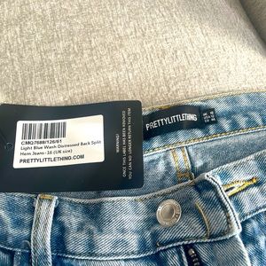 Light wash blue distressed jeans